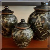 P05. 4 Pottery glazed 2 tone w/floral design ginger jars in varying heights. 14”h, 12”h, 10”h and 8”h - $150,145,125,85